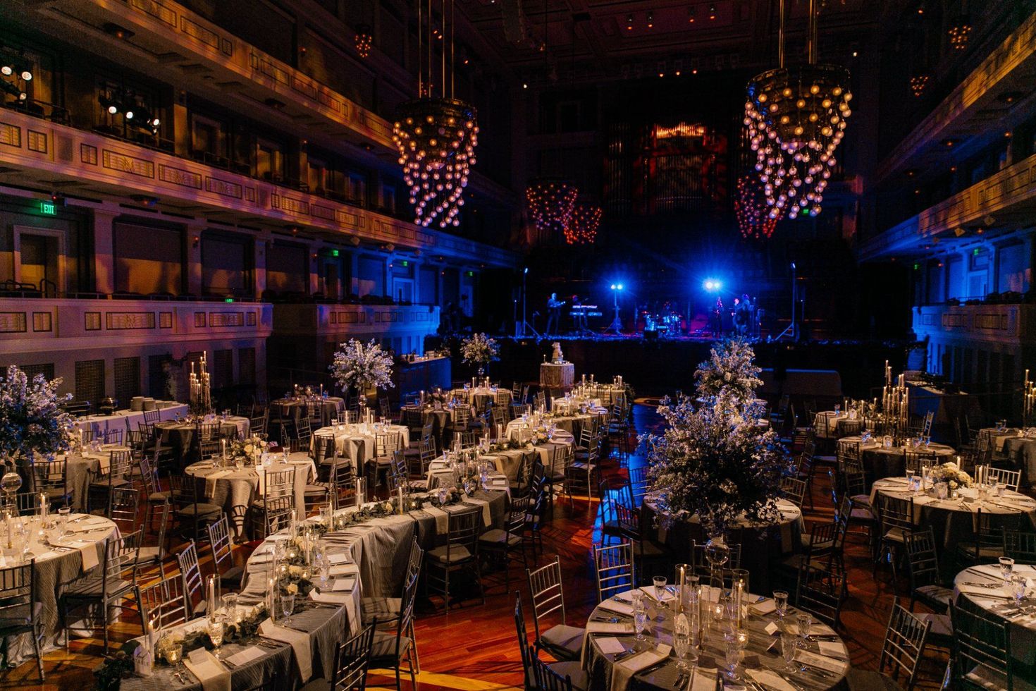 Dramatic blue-lit ballroom wedding reception